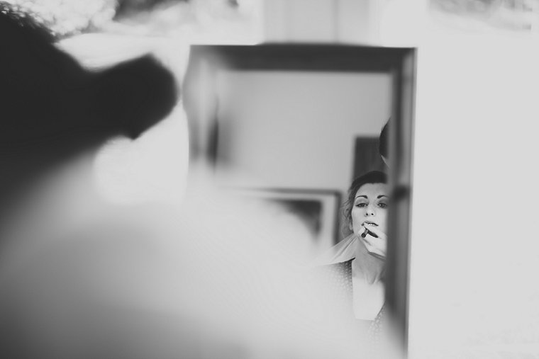 Bride looking into mirror
