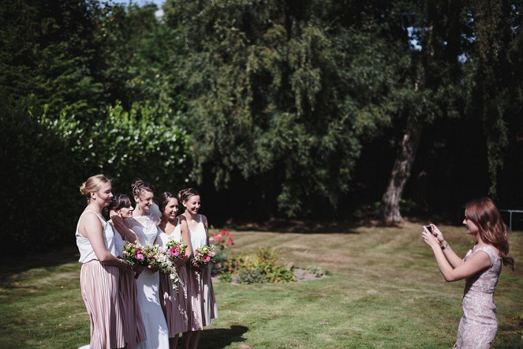 Bride and Bridesmaids posing for photo
