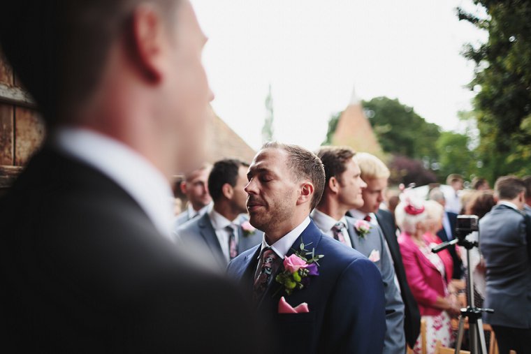 Groom looking nervous waiting for bride