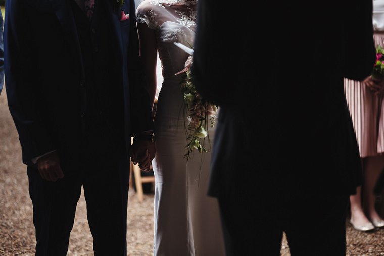 Bride and Groom holding hands