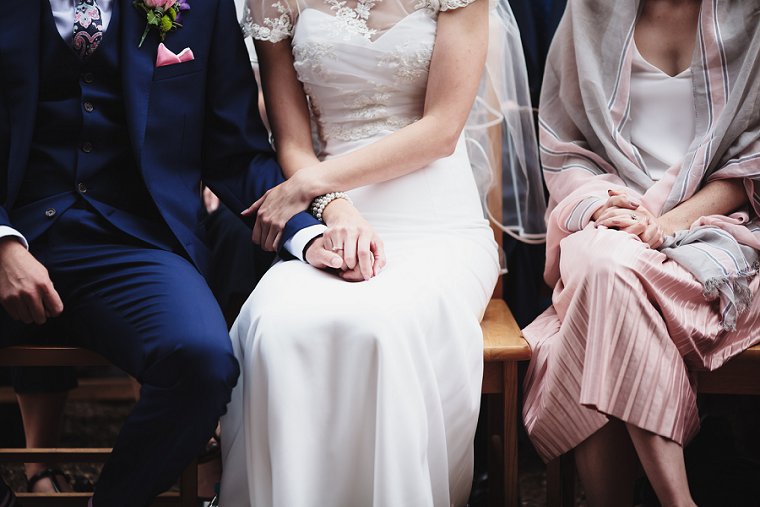 Bride and groom holding hands