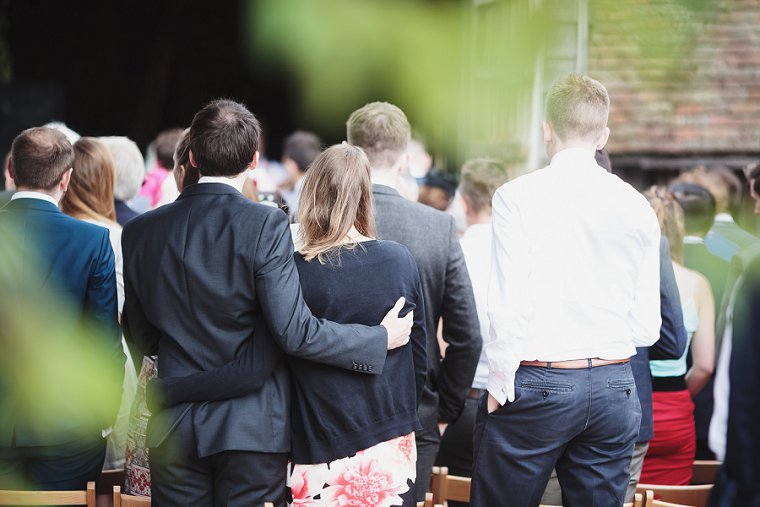 Wedding guests hugging at Ratsbury Barn