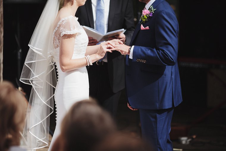 Bride and Groom holding hands at Ratsbury Barn