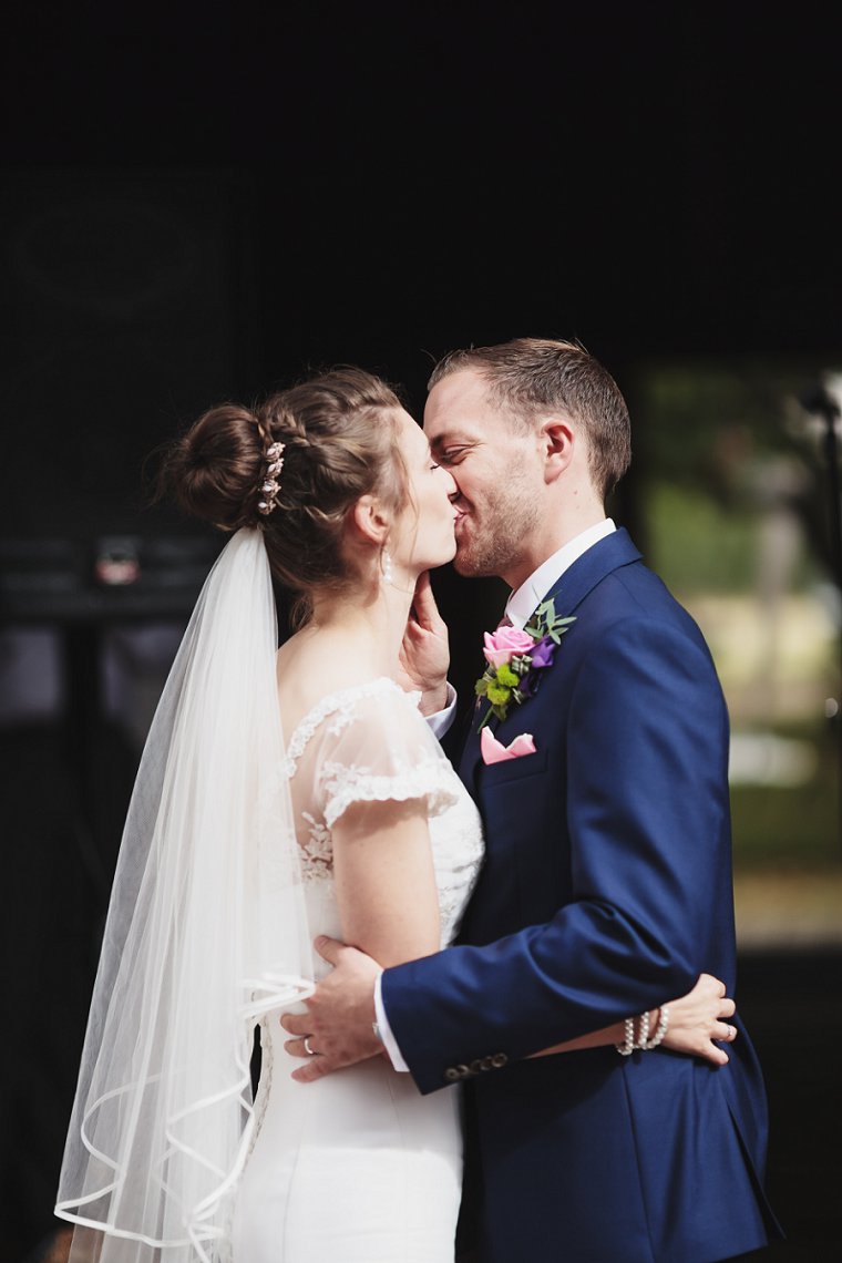 Bride and Groom first kiss at Ratsbury Barn