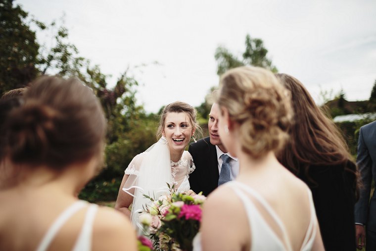 Bride hugging wedding guest