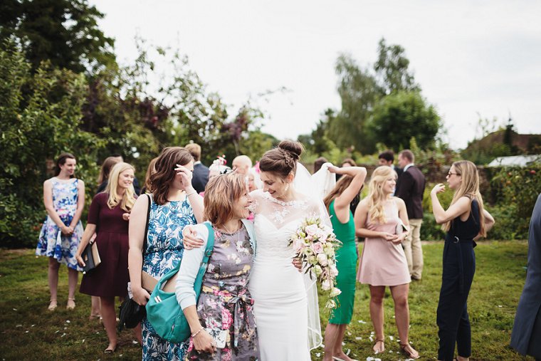 Bride hugging wedding guest at Ratsbury Barn Wedding