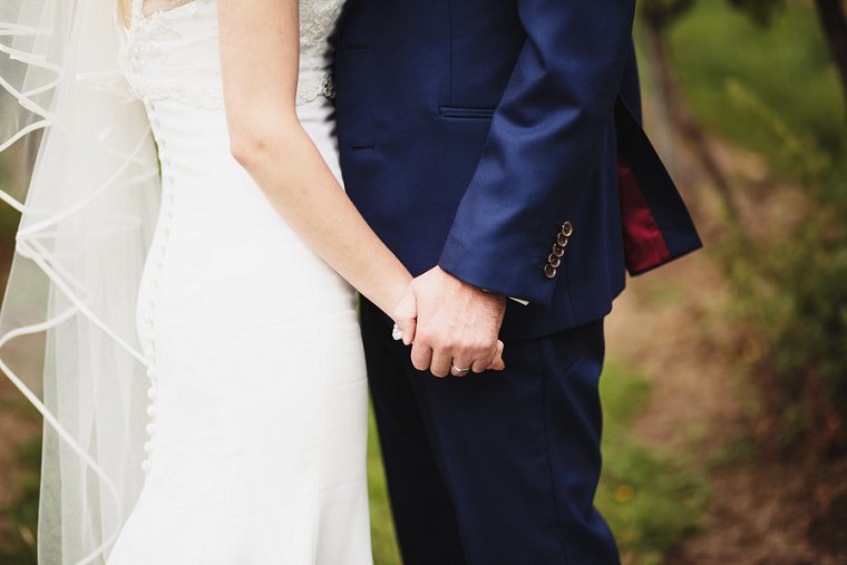 Bride and Groom holding hands