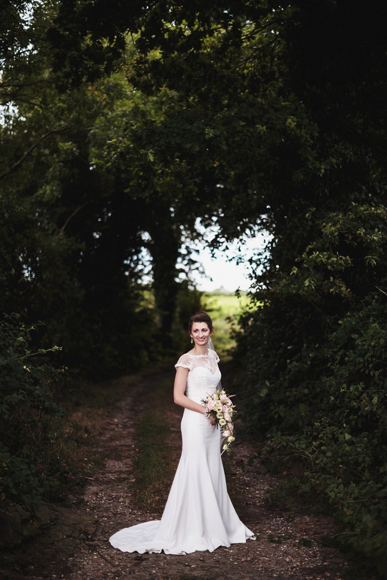 Bride posing with her bouquet