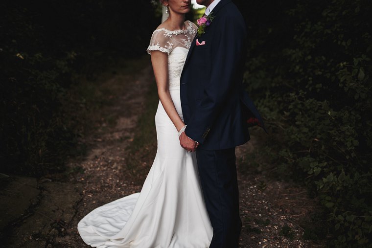 Bride and groom holding hands