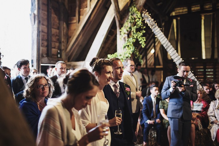 Couple laughing during wedding speeches