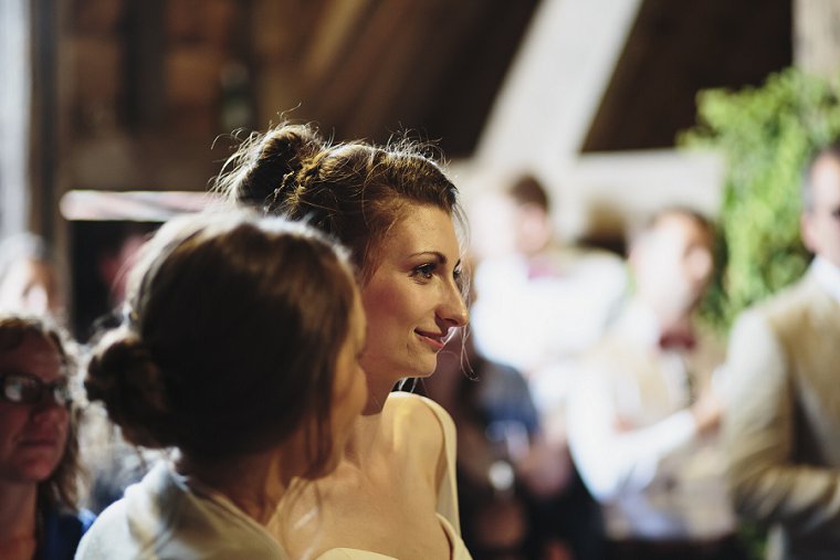 Bride watching during grooms speech
