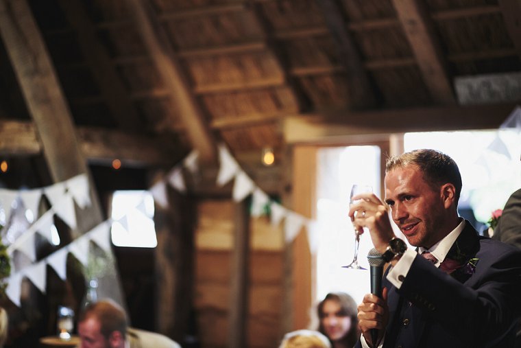 Groom toasting bride during speech