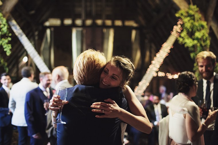 Bride hugging guest