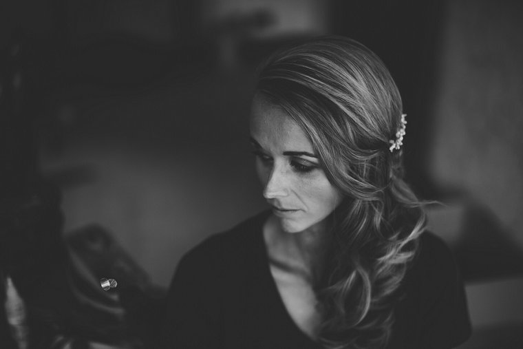 black and white image of bride getting ready for her Squerryes Court wedding