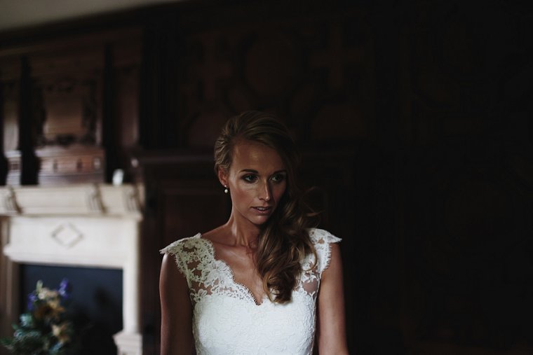 Bride looking in to mirror in her wedding dress
