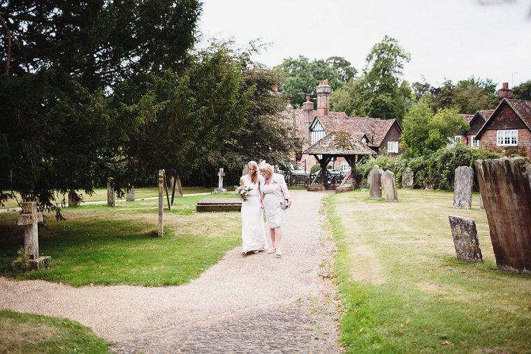 Bride walking in to church with her mum