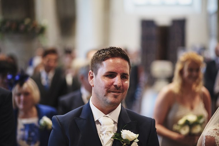 Groom smiling before his wedding