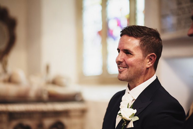 Groom smiling after wedding service
