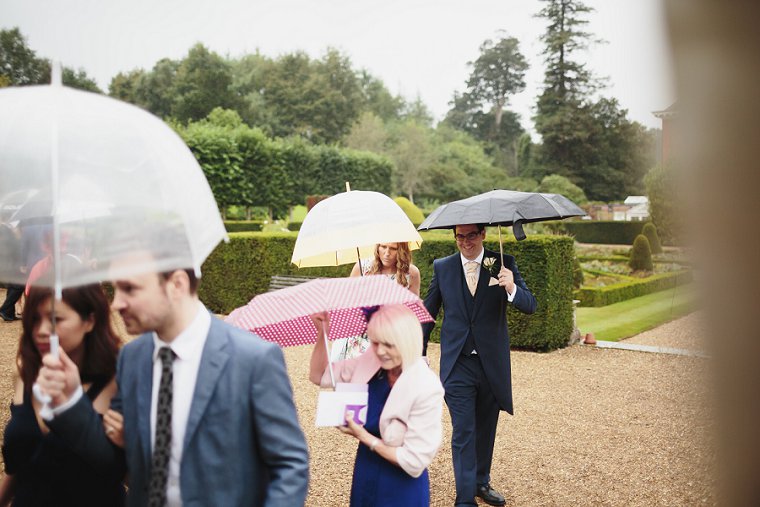 Rainy wedding day guests in Kent