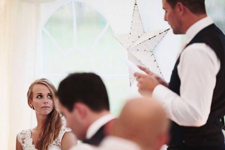 Bride looking at Groom during Grooms speech
