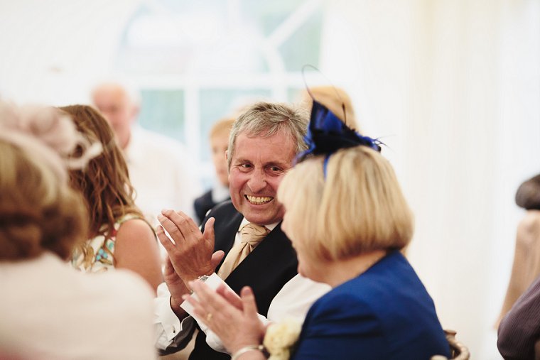 Father of groom laughing during the best mans speech