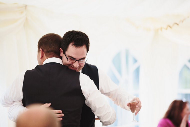 Groom and Best Man hug after his speech