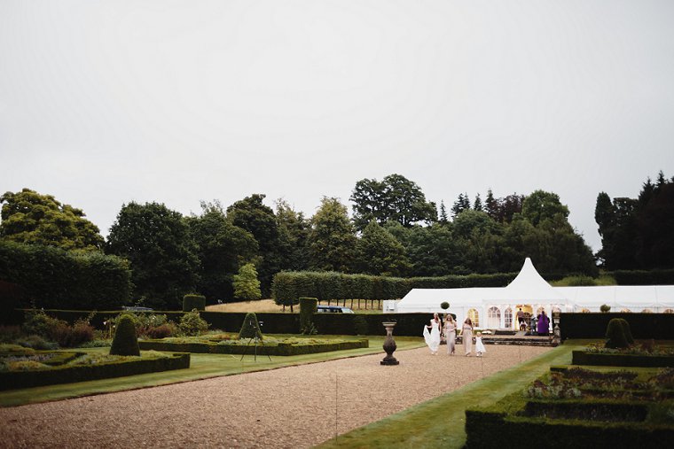 Bride walking with friends at Squerryes Court Wedding venue in Kent