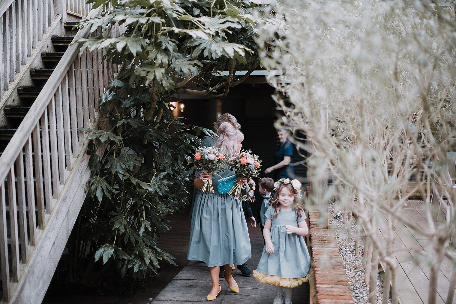 bridesmaid and flower girl walking together