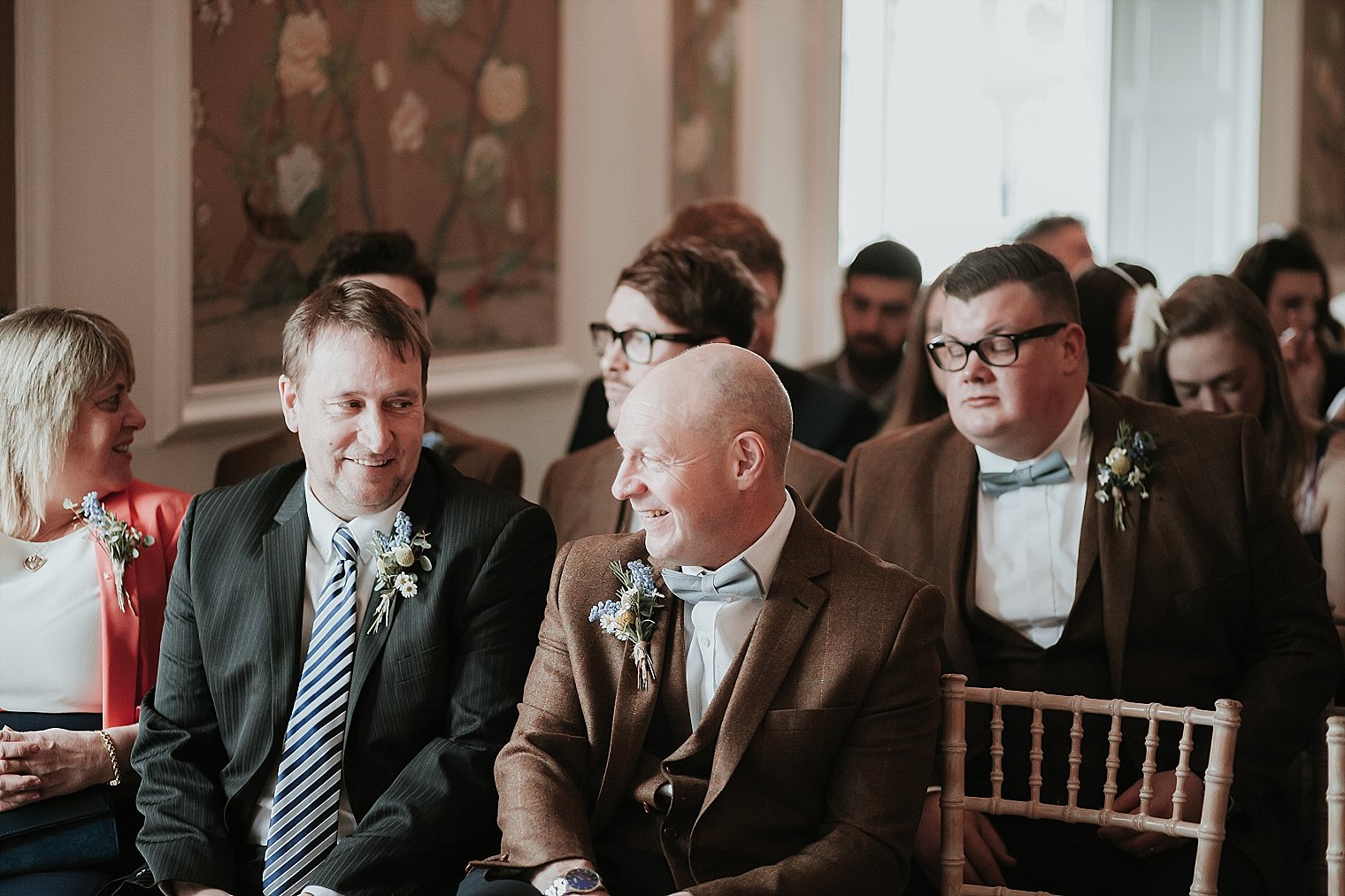 Father of the groom laughing