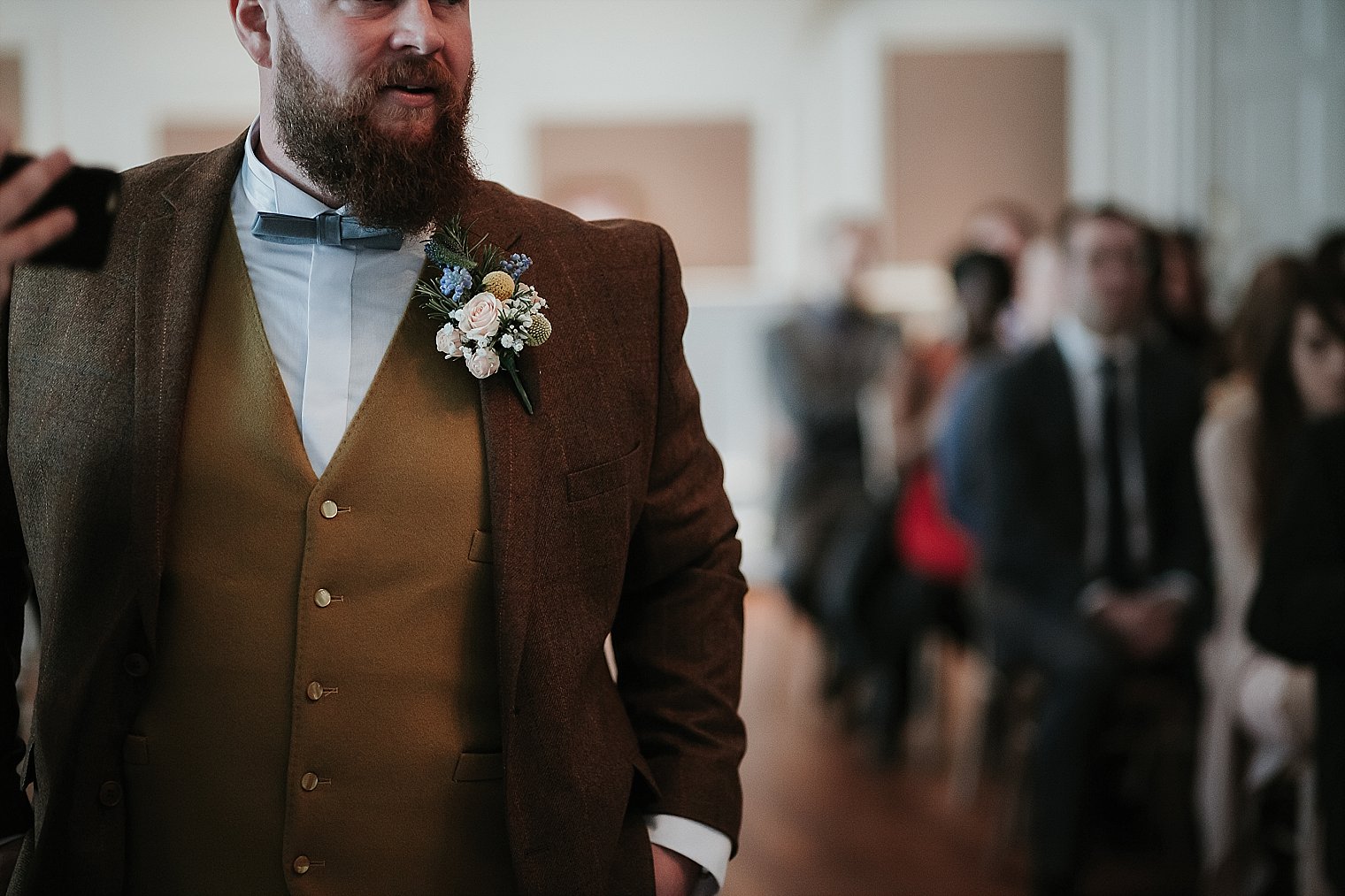 Groom waiting at front of the room