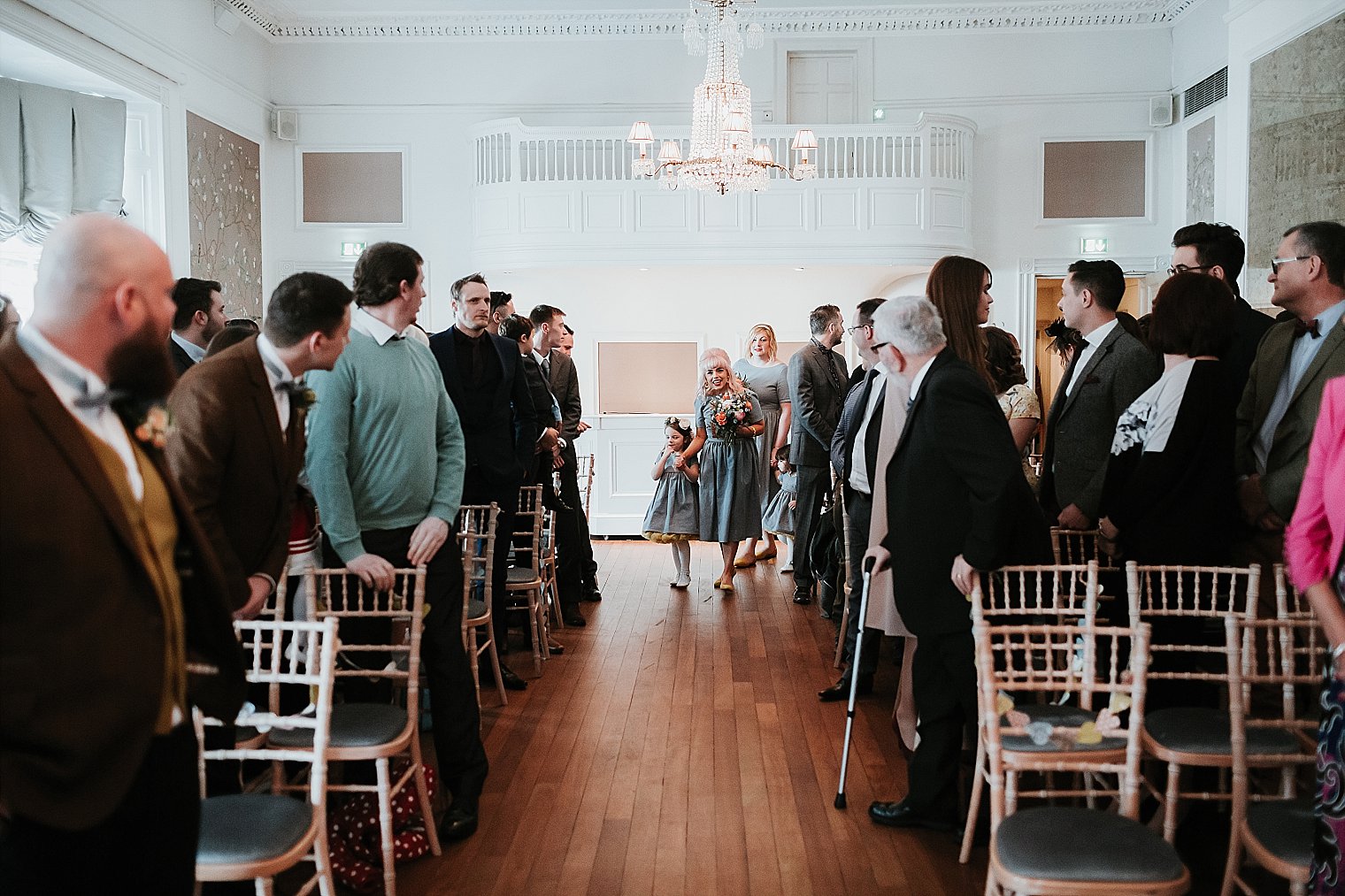 Bridesmaids entering wedding ceremony