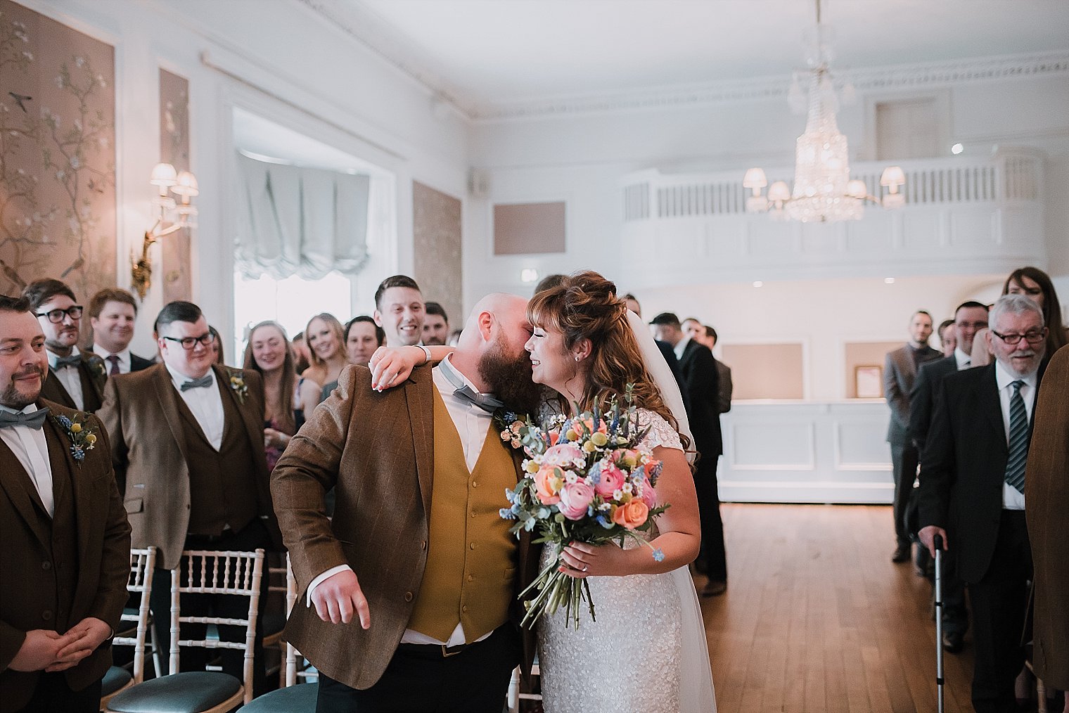 Bride and Groom hugging after her arrival