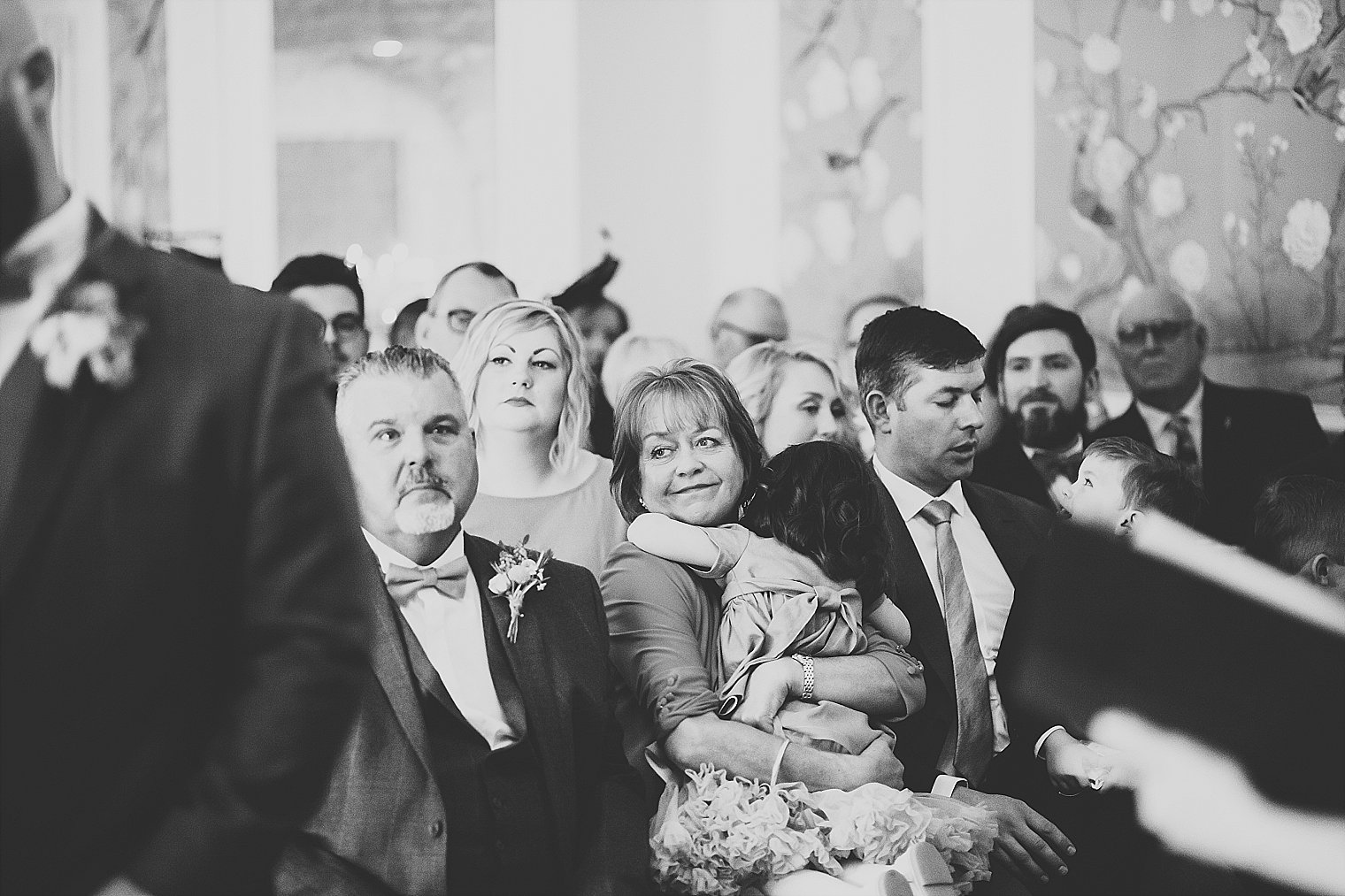Mother of the bride holding her grand daughter