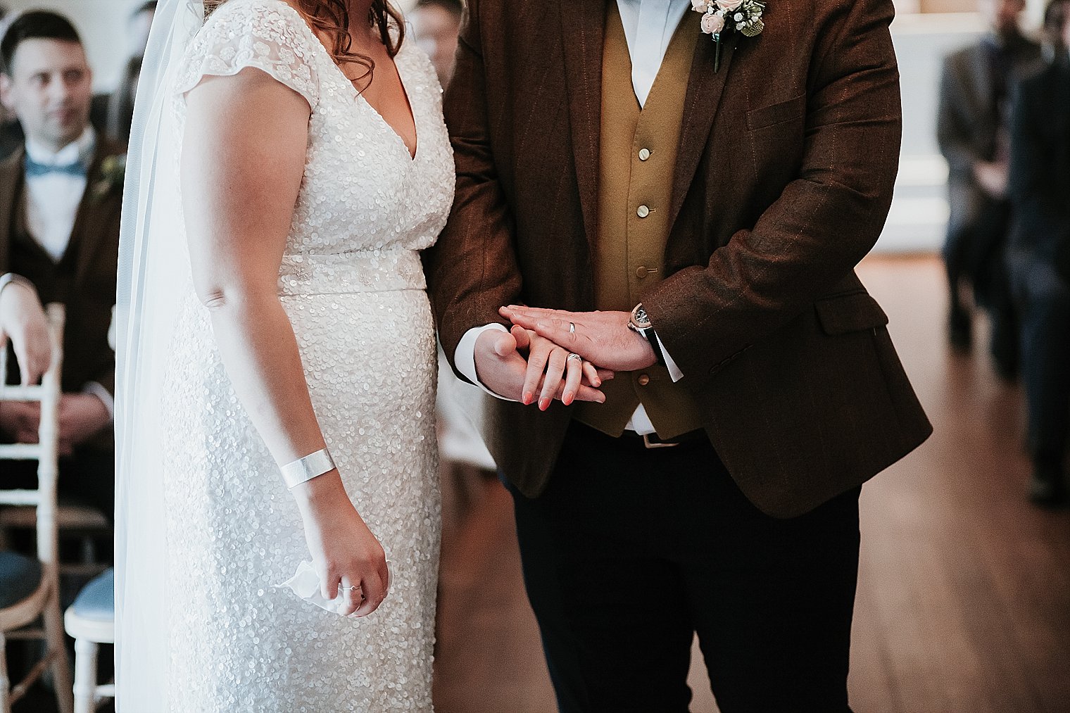 Bride and groom holding hands