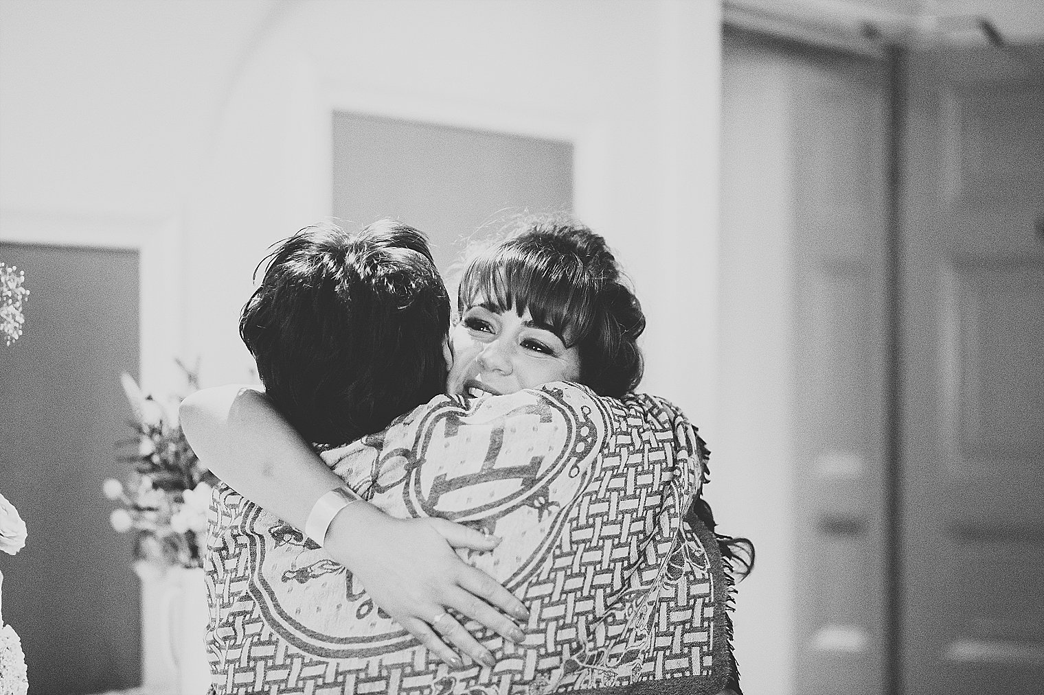 Bride hugging her friend