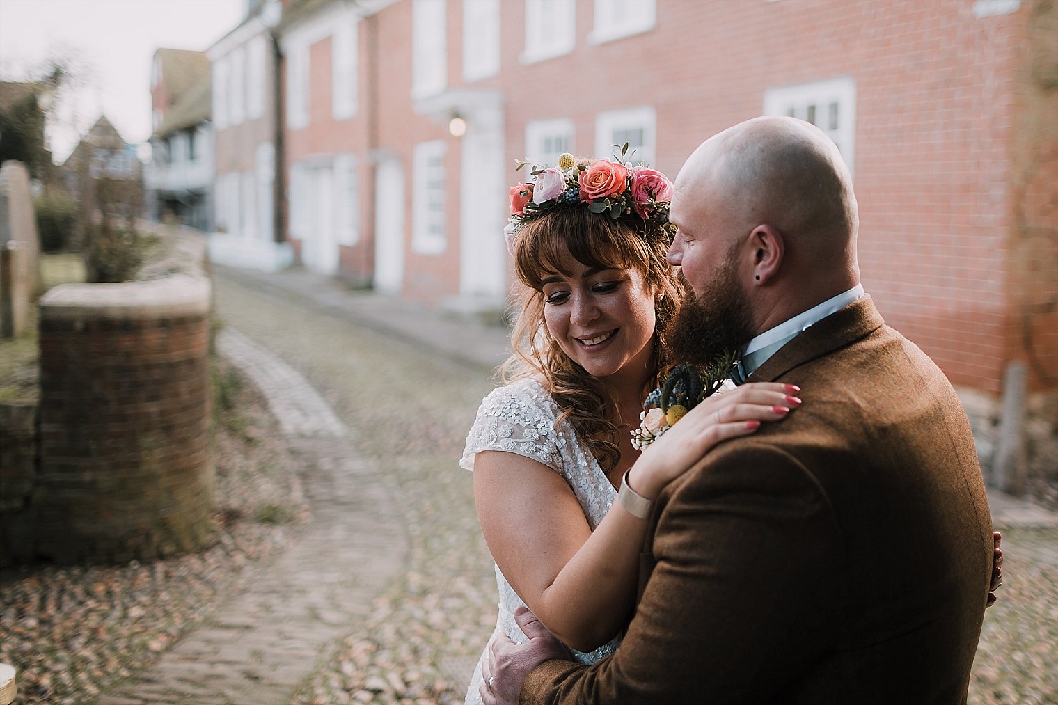 Bride and Groom laughing in Rye