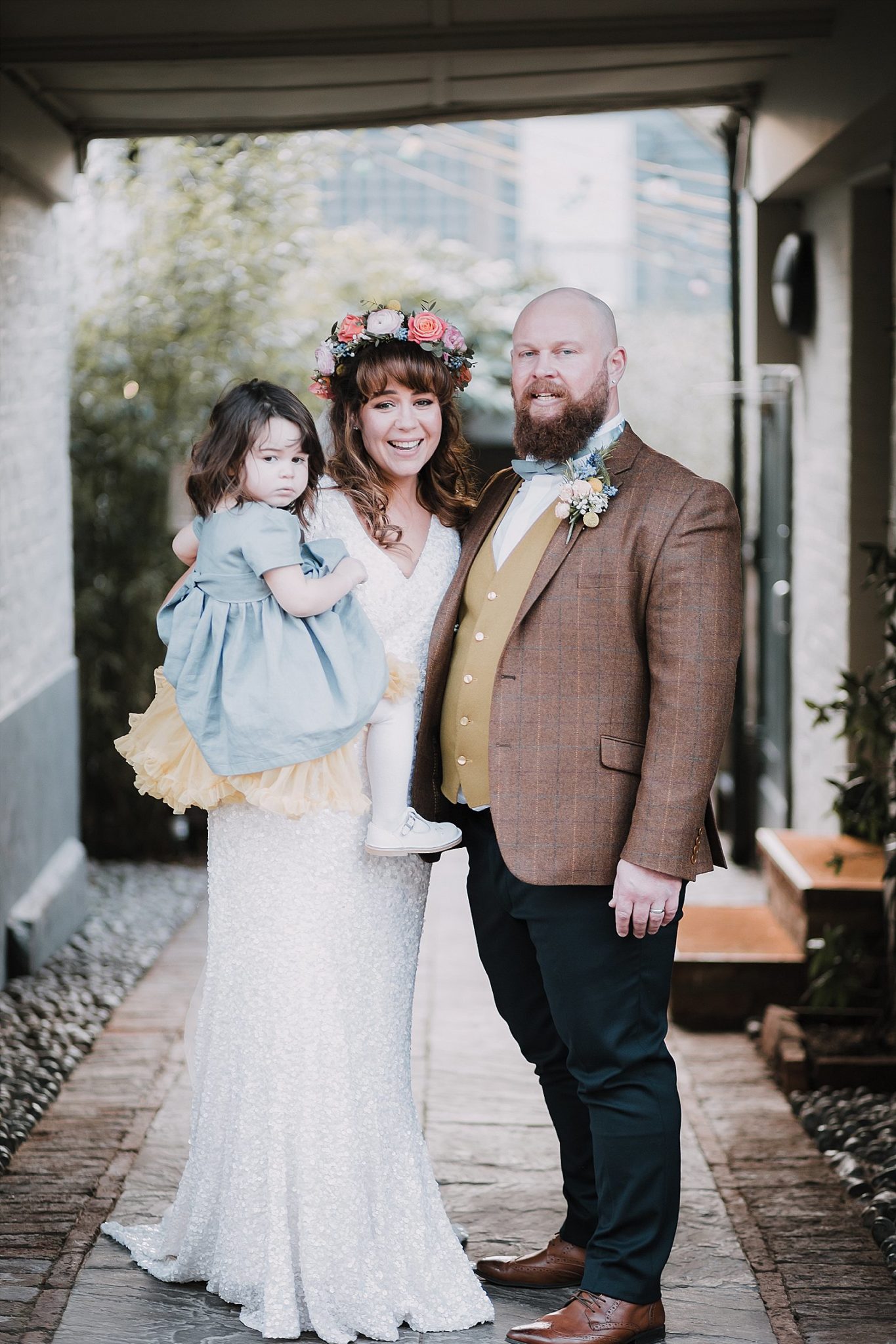 Formal group portrait of bride and groom