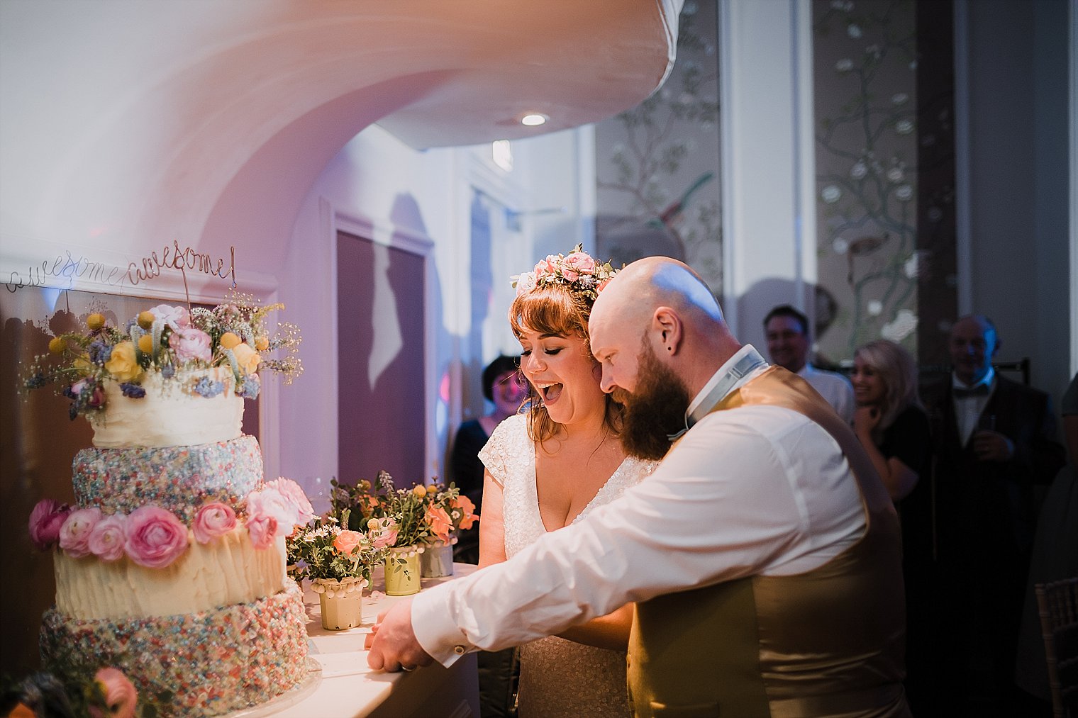 Bride and groom cutting the cake