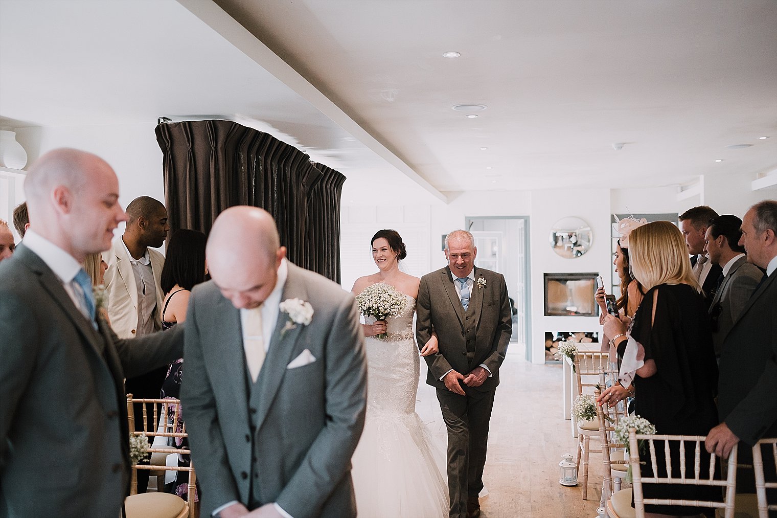 Bride walking down the aisle with her father