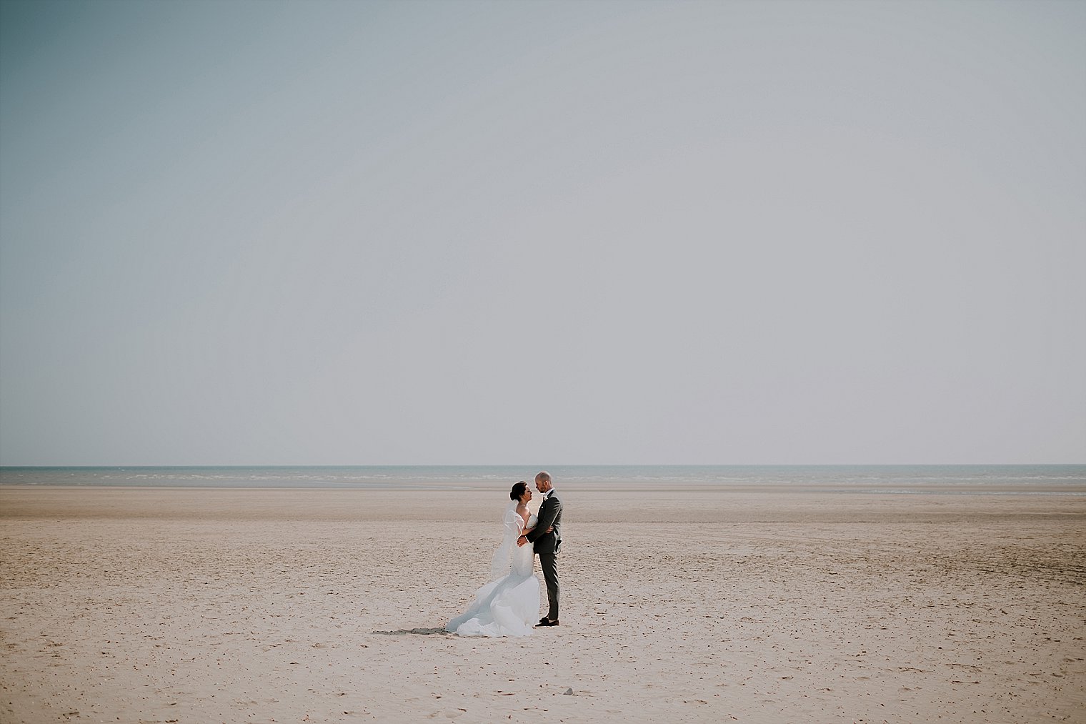 The Gallivant Wedding Bride and Groom on beach