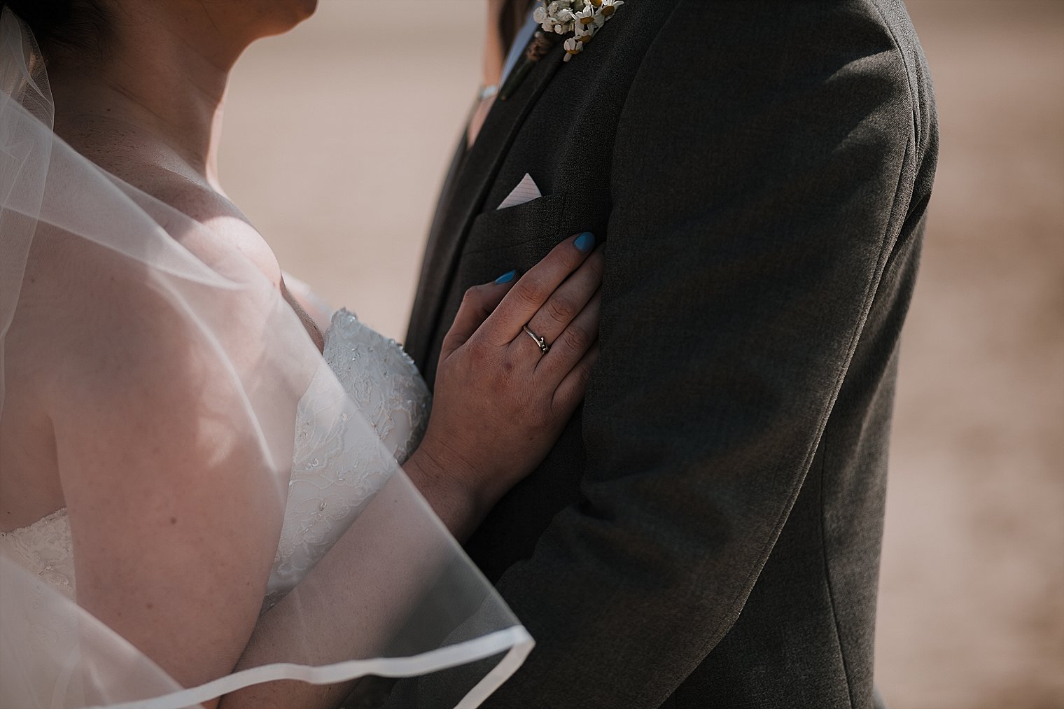 Close up of bride and groom hugging
