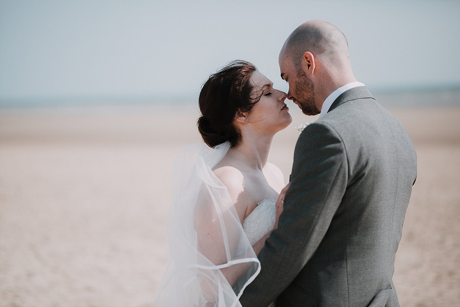 Bride and groom kissing