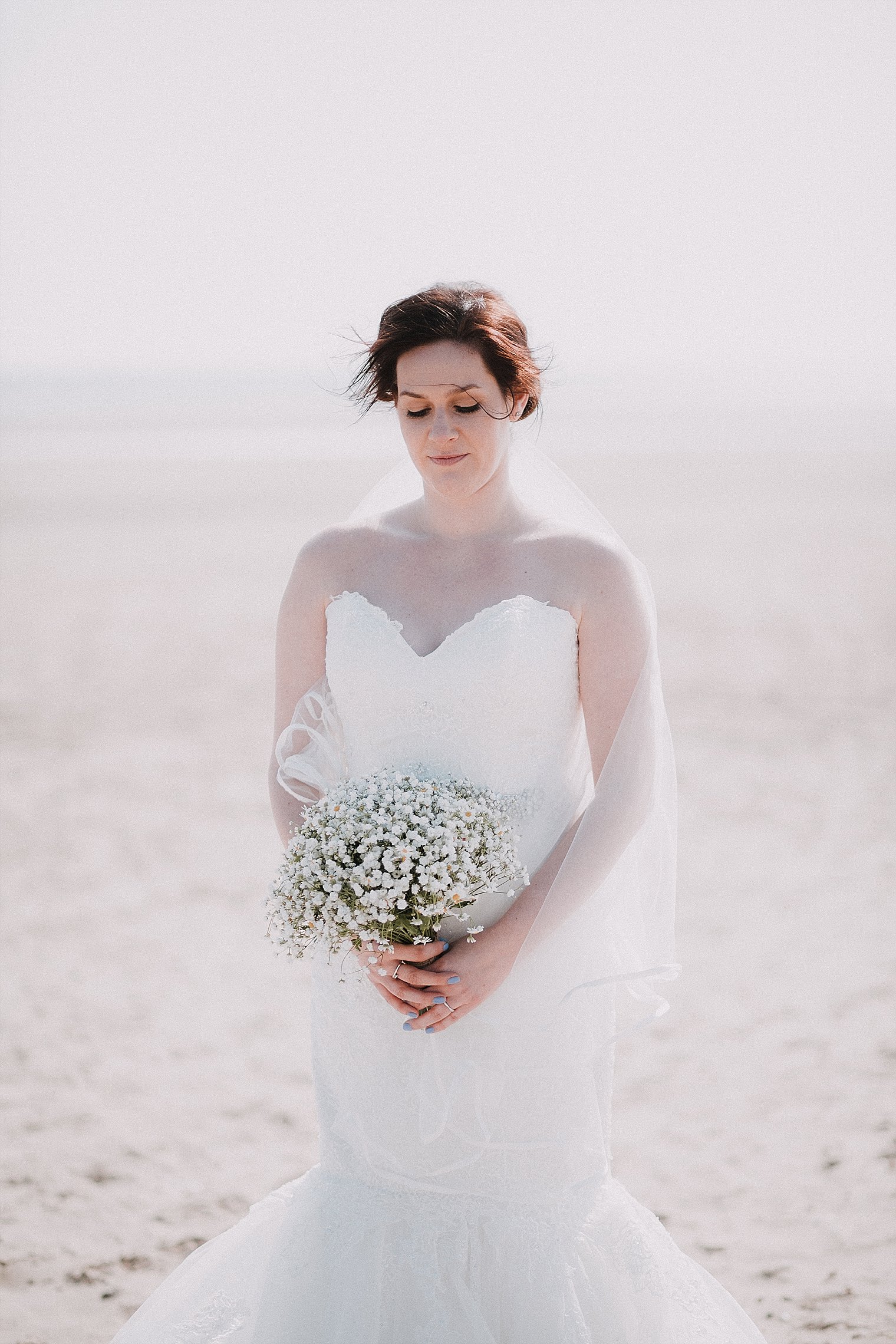 Bride holding her wedding flowers at The Gallivant