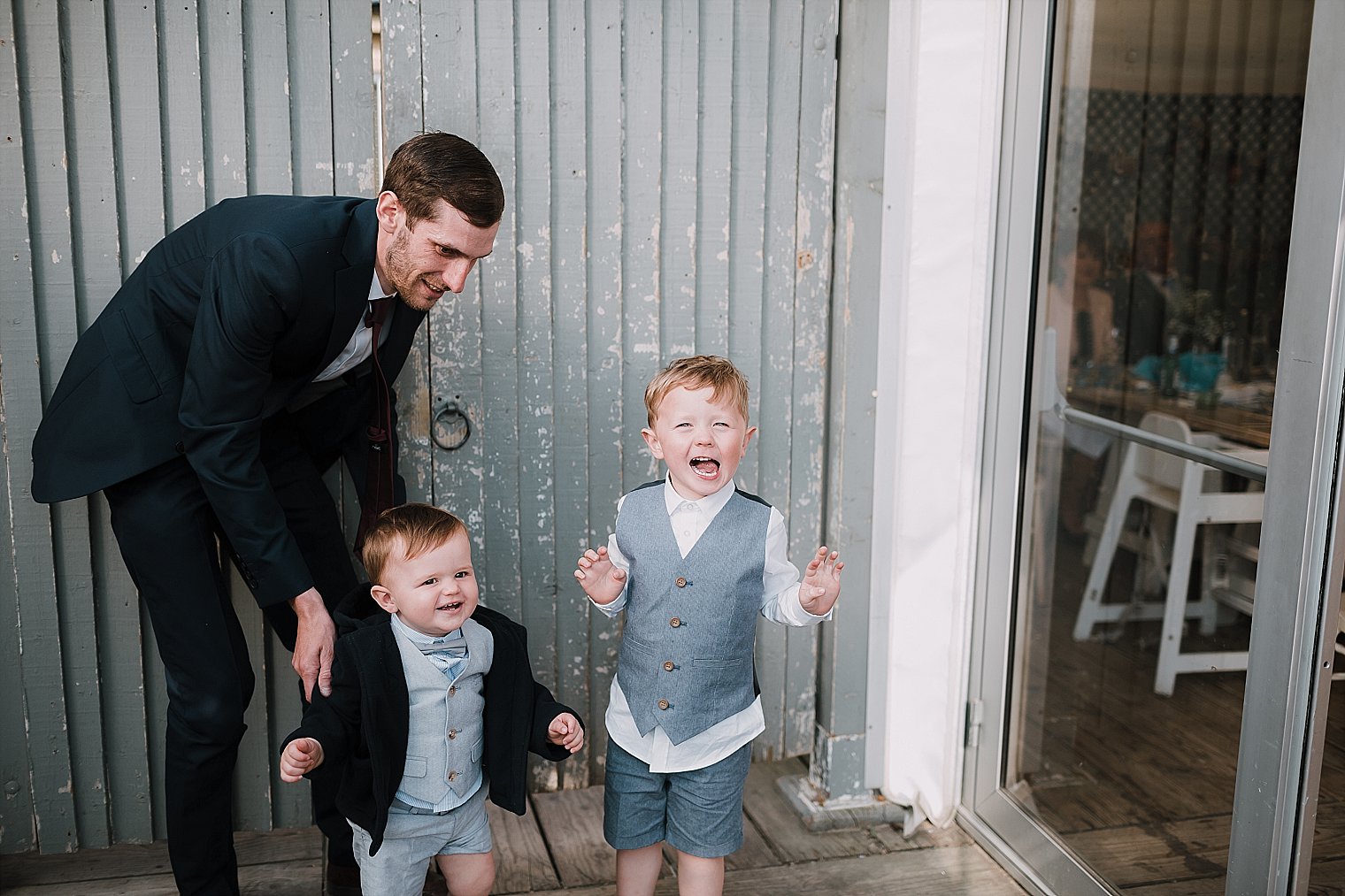 Young wedding guests laughing