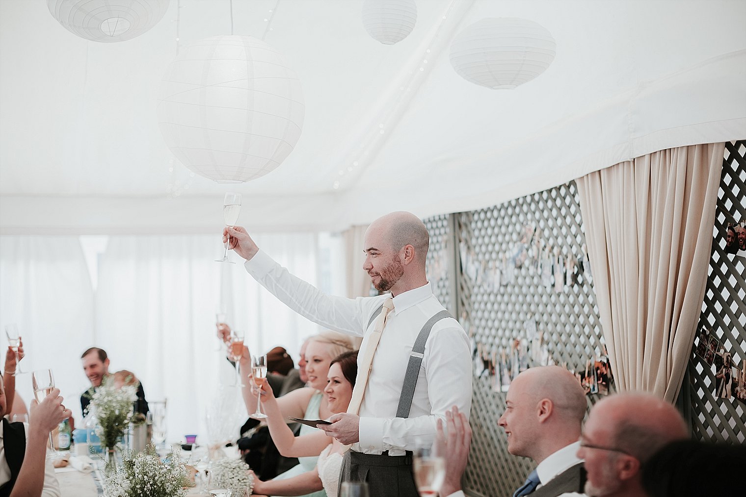 Groom toasting bridesmaids