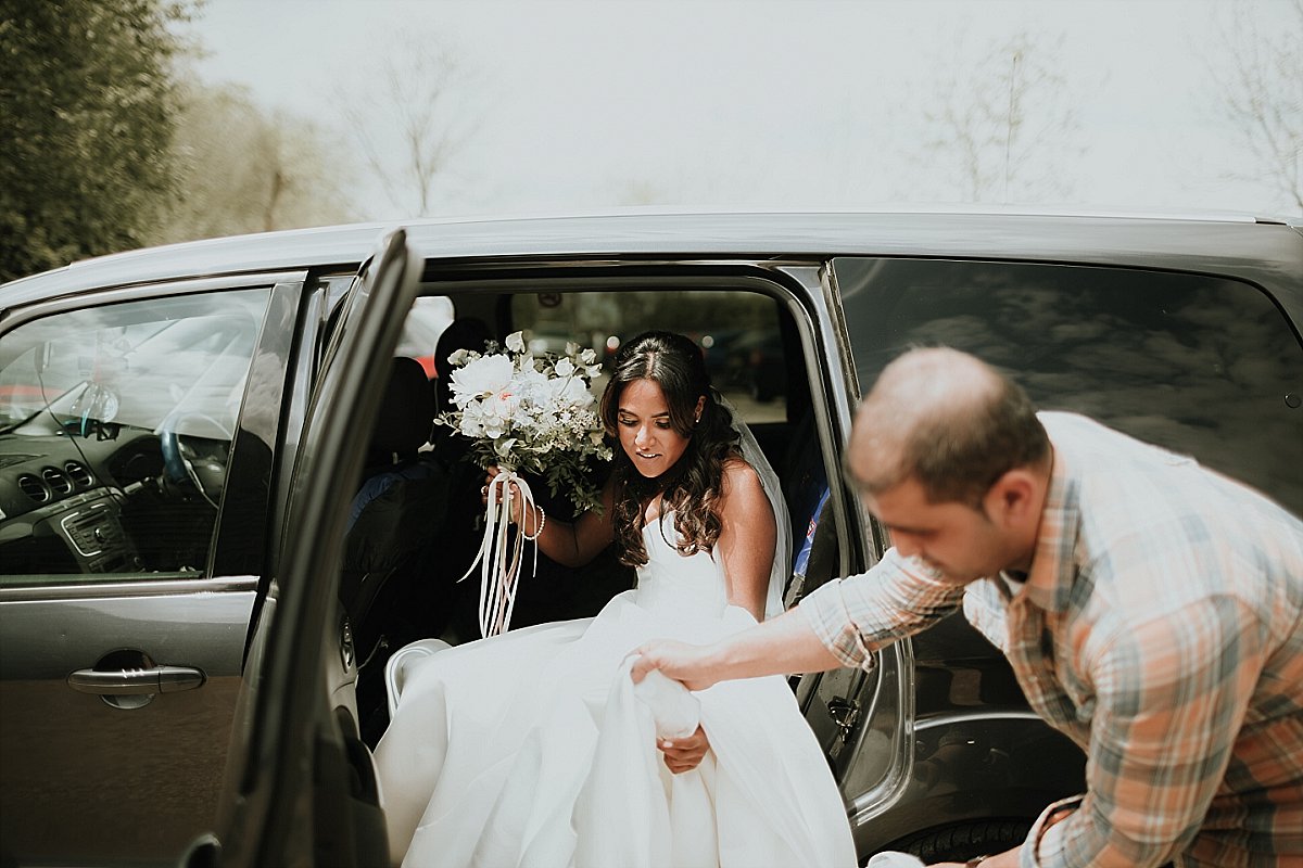 Bride getting out of car