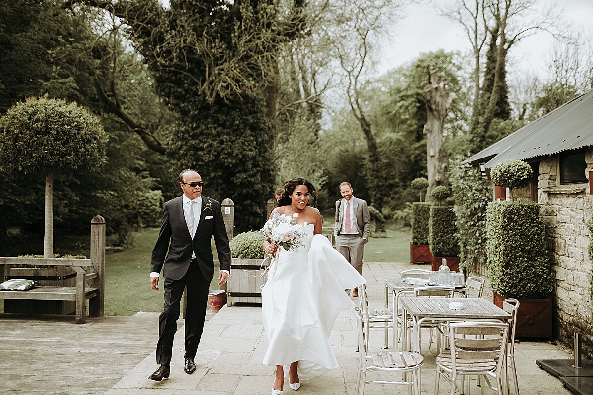 Bride walking in to Cripps Barn