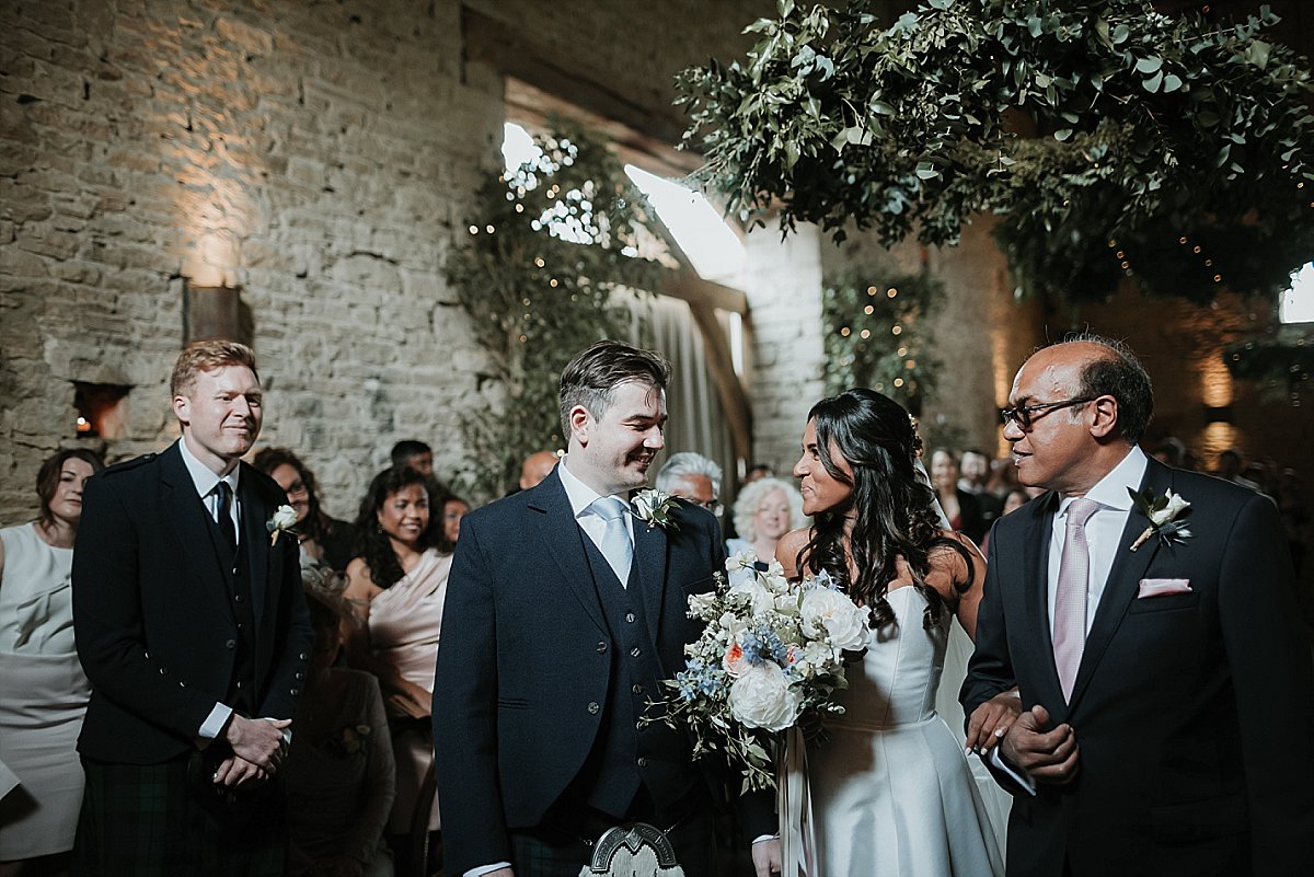 Groom looking at bride