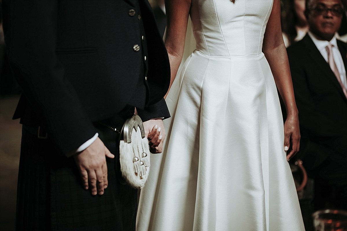 Bride and groom holding hands