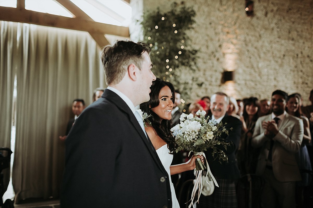 Bride and groom walking down the aisle